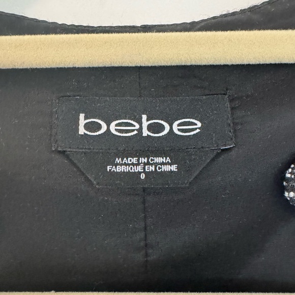 Form-fitted, front zip, peplum tweed dress from BeBe - Picture 3 of 3